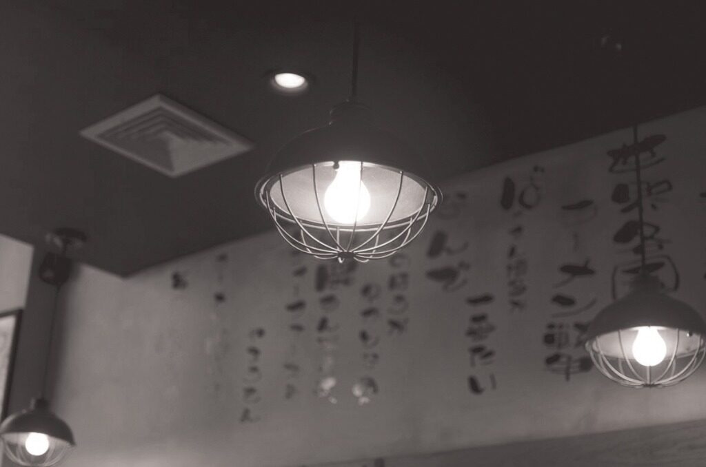 Under the caged bulbs at Nishida Sho-ten